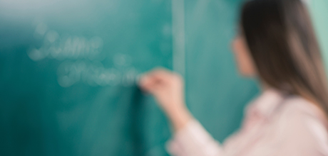 Teacher using blackboard