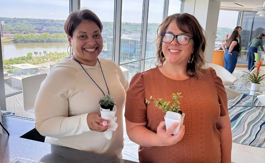 Two people planting plants for Earth Day