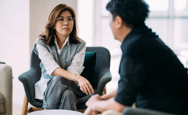 Coworkers talking in an office