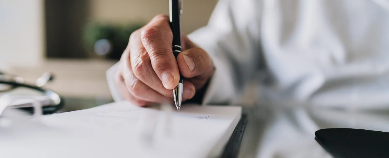 Person writing a checklist