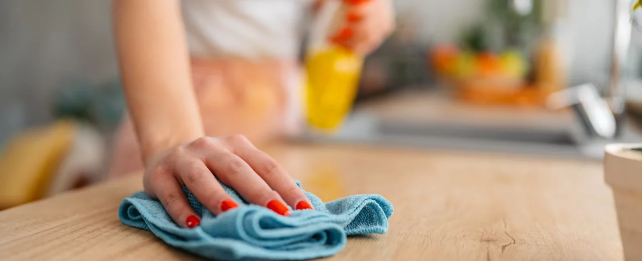 Person cleaning a counter