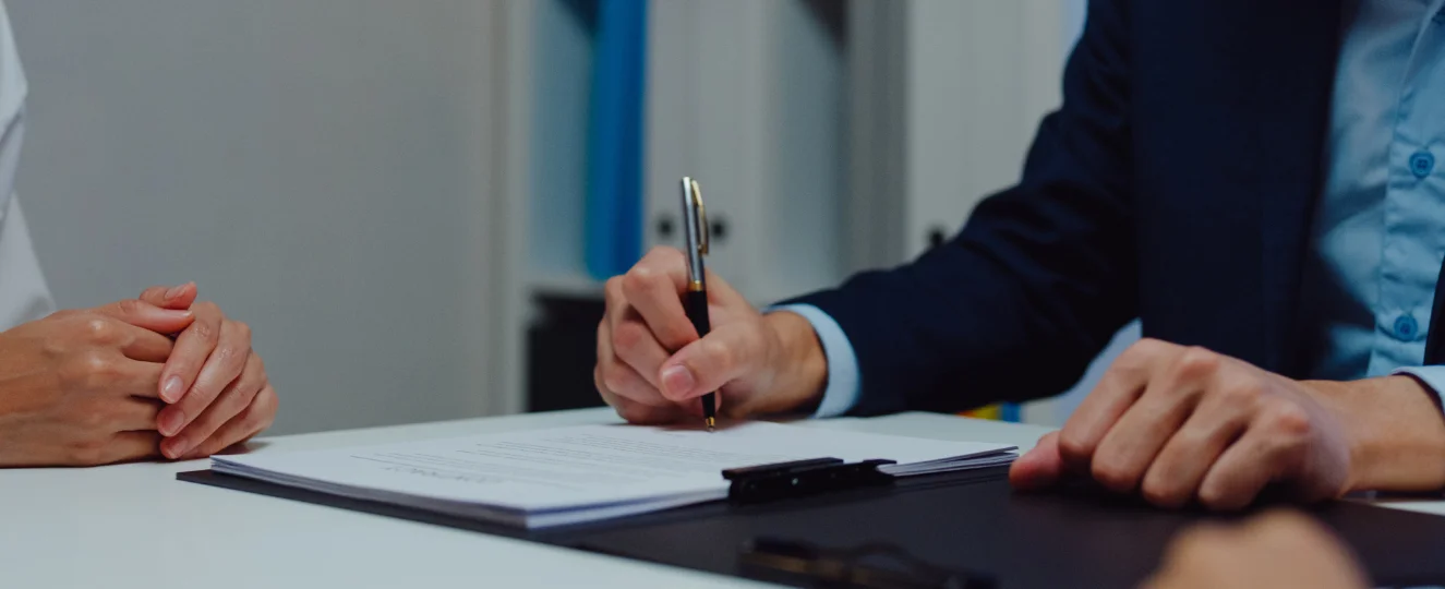 Person writing a document